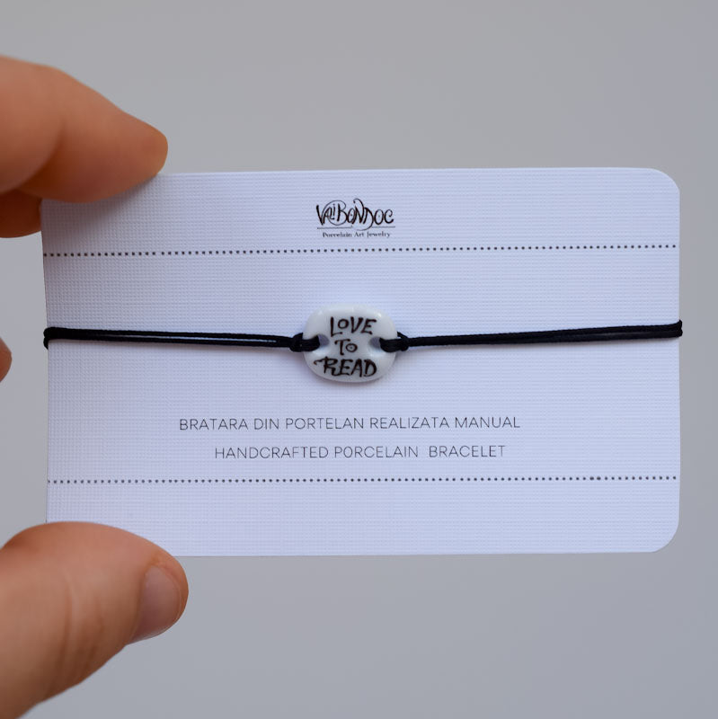 Love to read Porcelain bracelet handmade and hand painted by Vali Bondoc. Bratara din portelan modelata si pictata manual de Vali Bondoc