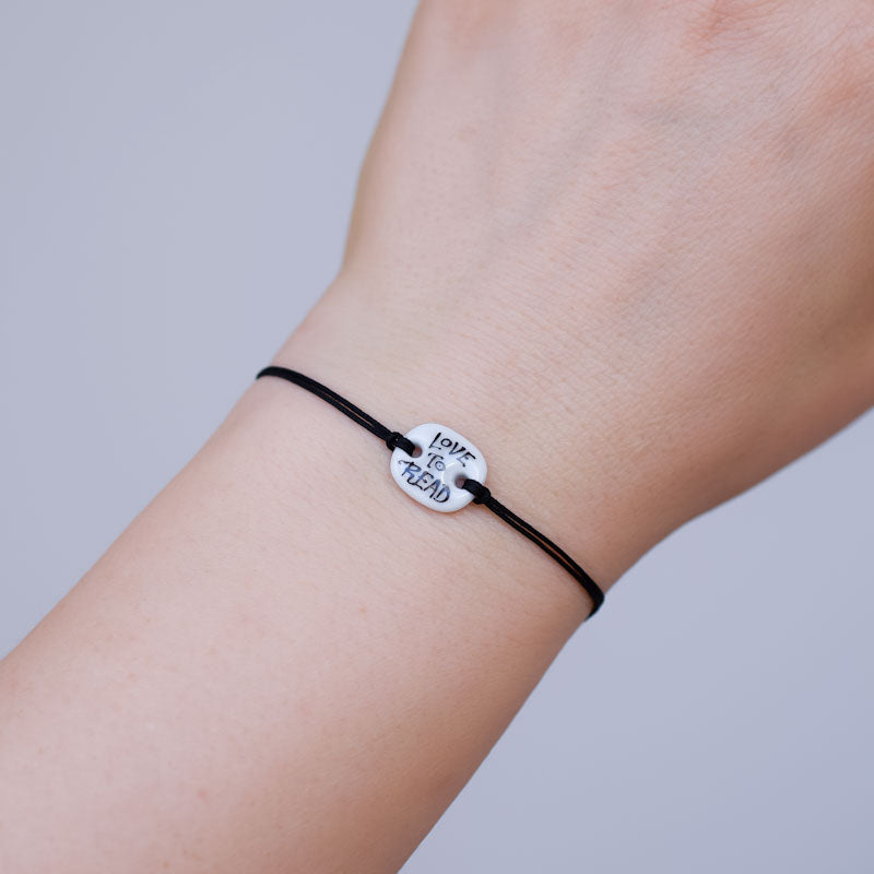 Love to read Porcelain bracelet handmade and hand painted by Vali Bondoc. Bratara din portelan modelata si pictata manual de Vali Bondoc