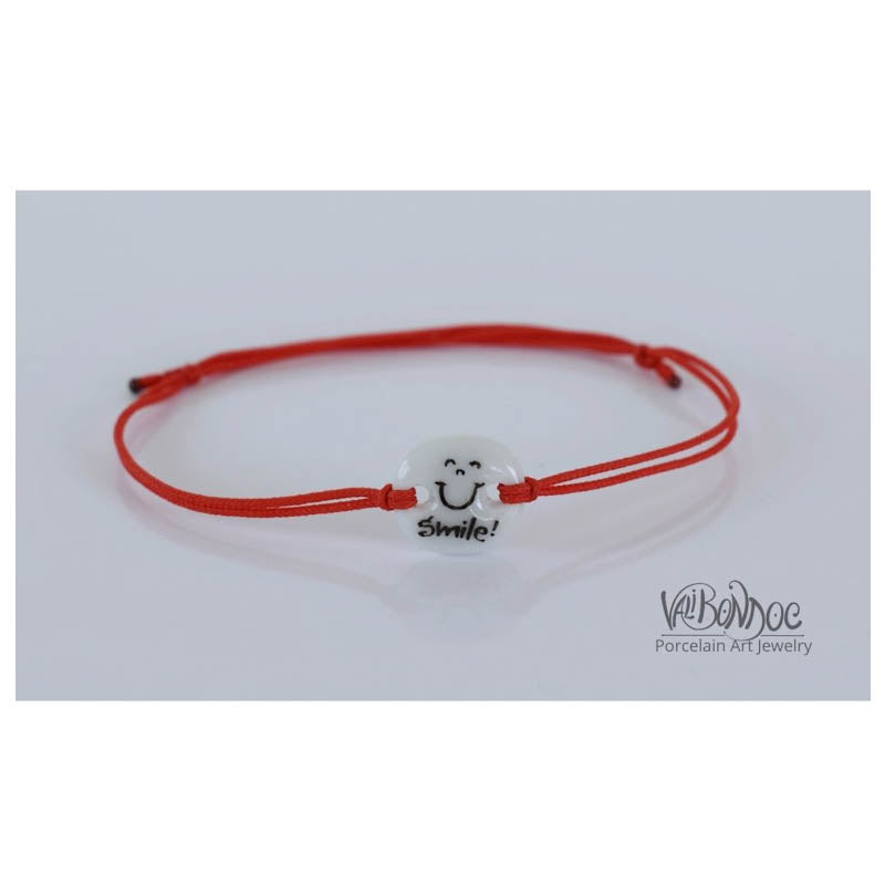Smile. Porcelain bracelet handmade and hand painted by Vali Bondoc