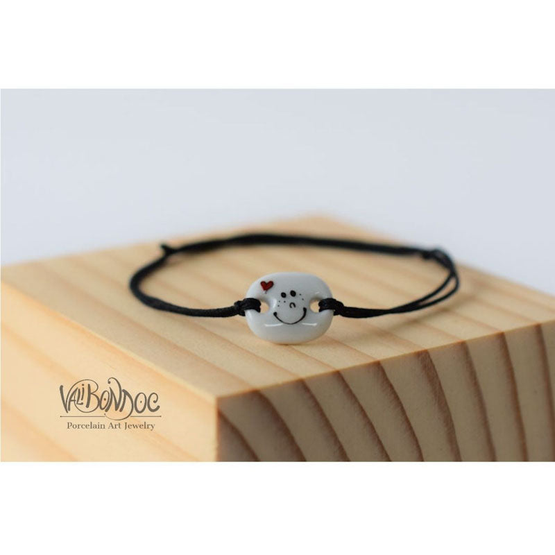 Smiley face with heart .Porcelain bracelet handmade and hand painted by Vali Bondoc