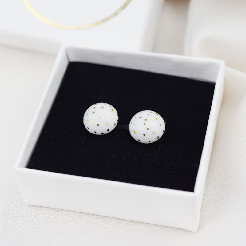 Porcelain stud earrings created and hand-painted by Vali Bondoc with high temperature ceramic dyes and colloidal gold