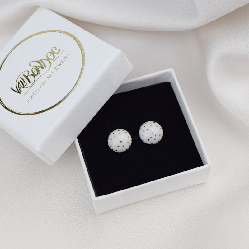 Porcelain stud earrings created and hand-painted by Vali Bondoc with high temperature ceramic dyes and colloidal gold