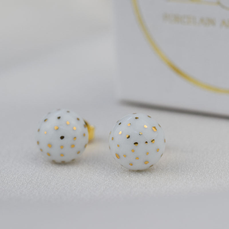 Porcelain stud earrings created and hand-painted by Vali Bondoc with high temperature ceramic dyes and colloidal gold