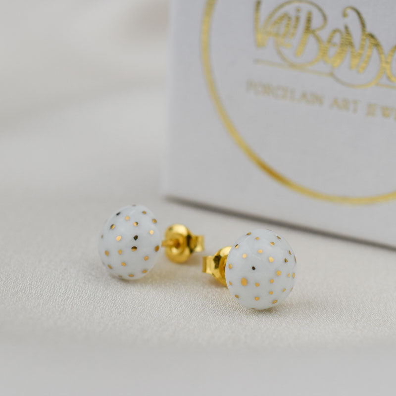 Porcelain stud earrings created and hand-painted by Vali Bondoc with high temperature ceramic dyes and colloidal gold