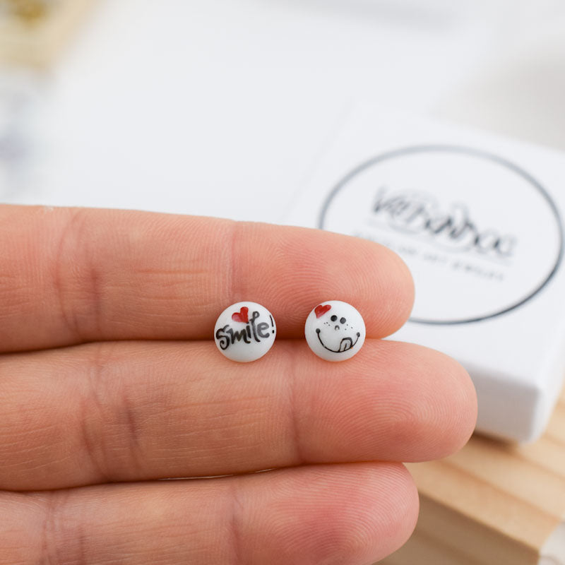 Porcelain stud earrings created and hand-painted by Vali Bondoc with high temperature ceramic dyes