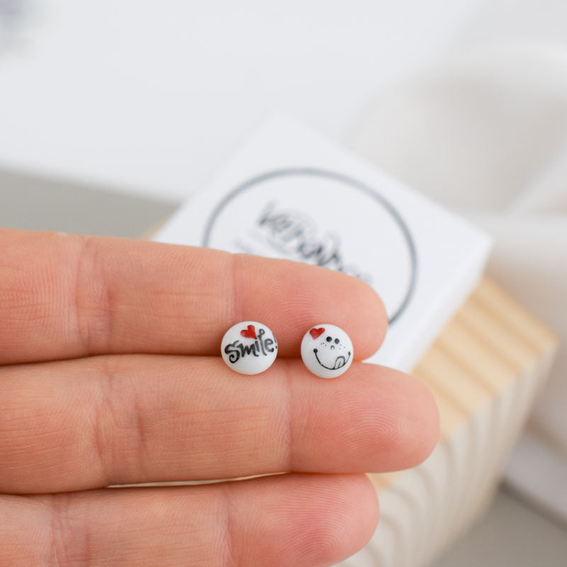 Porcelain stud earrings created and hand-painted by Vali Bondoc with high temperature ceramic dyes