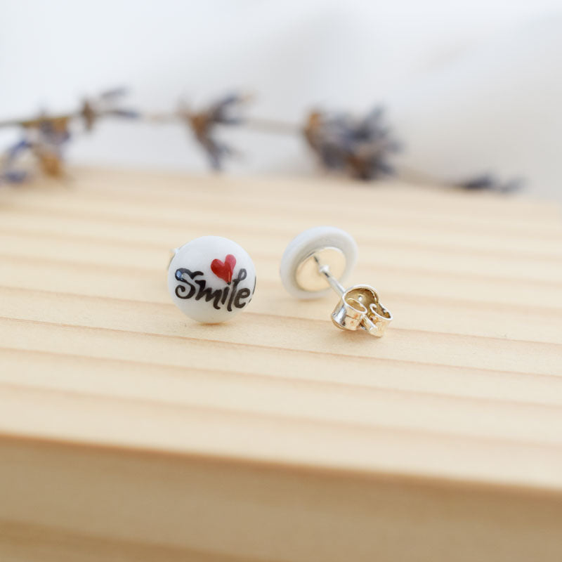 Porcelain stud earrings created and hand-painted by Vali Bondoc with high temperature ceramic dyes