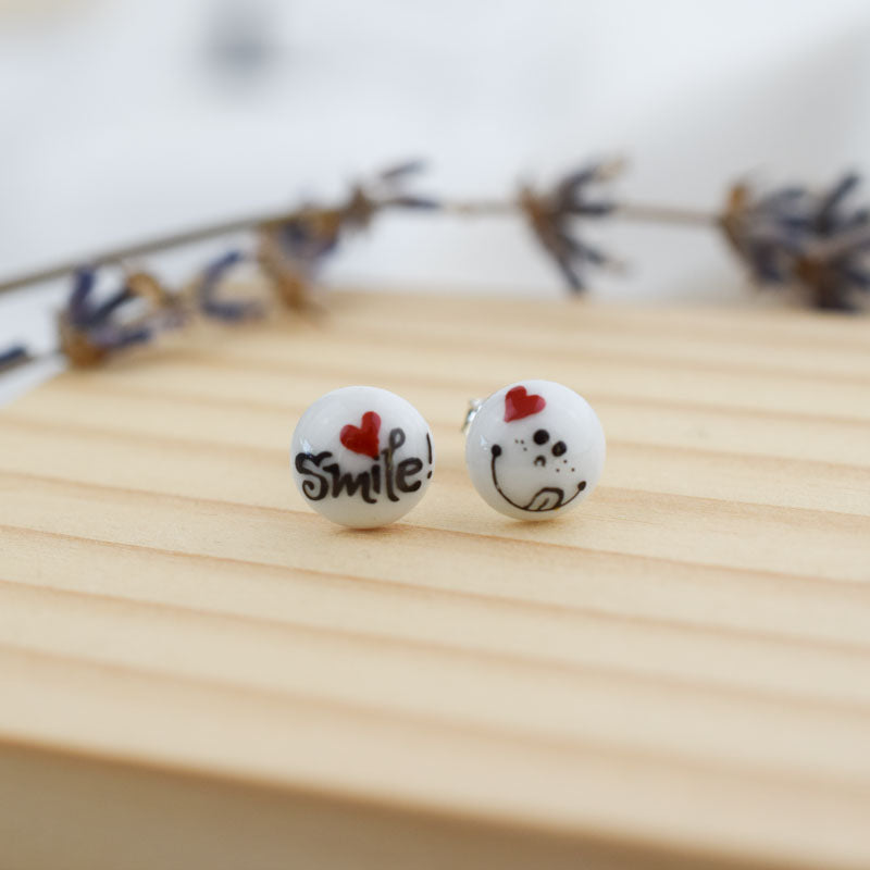 Porcelain stud earrings created and hand-painted by Vali Bondoc with high temperature ceramic dyes