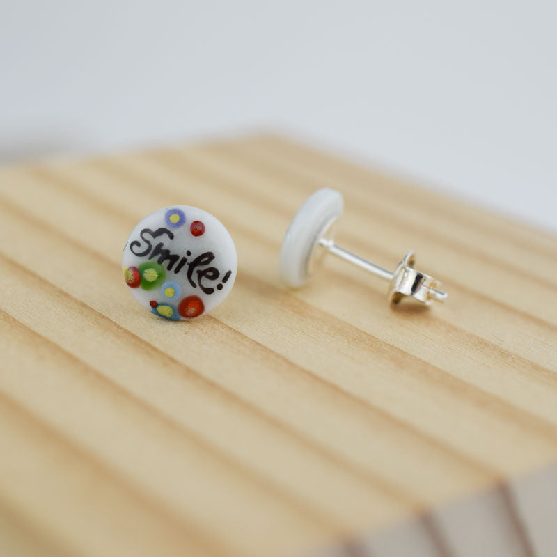 Porcelain stud earrings created and hand-painted by Vali Bondoc with high temperature ceramic dyes 