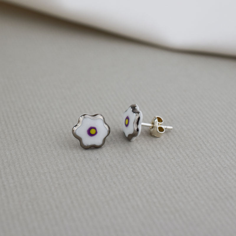 Porcelain stud earrings created and hand-painted by Vali Bondoc with high temperature ceramic dyes and colloidal gold