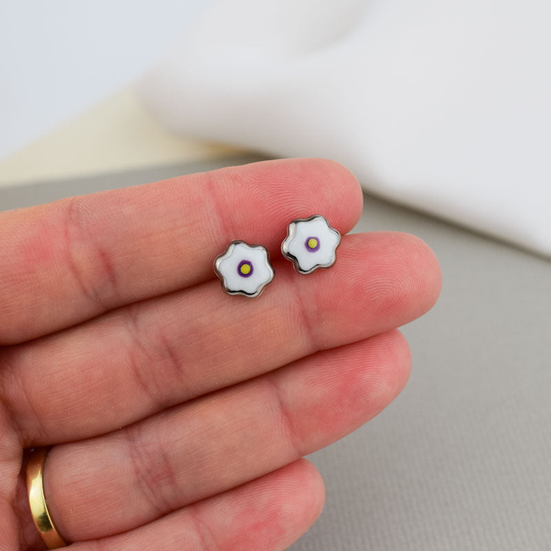 Porcelain stud earrings created and hand-painted by Vali Bondoc with high temperature ceramic dyes and colloidal gold