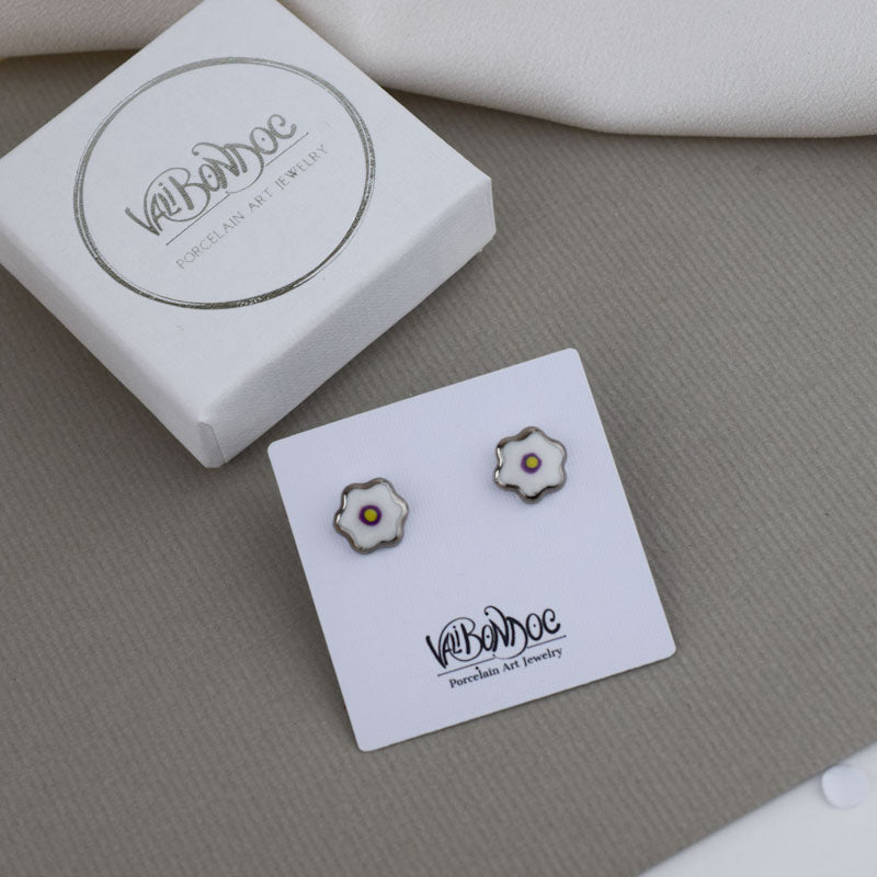 Porcelain stud earrings created and hand-painted by Vali Bondoc with high temperature ceramic dyes and colloidal gold