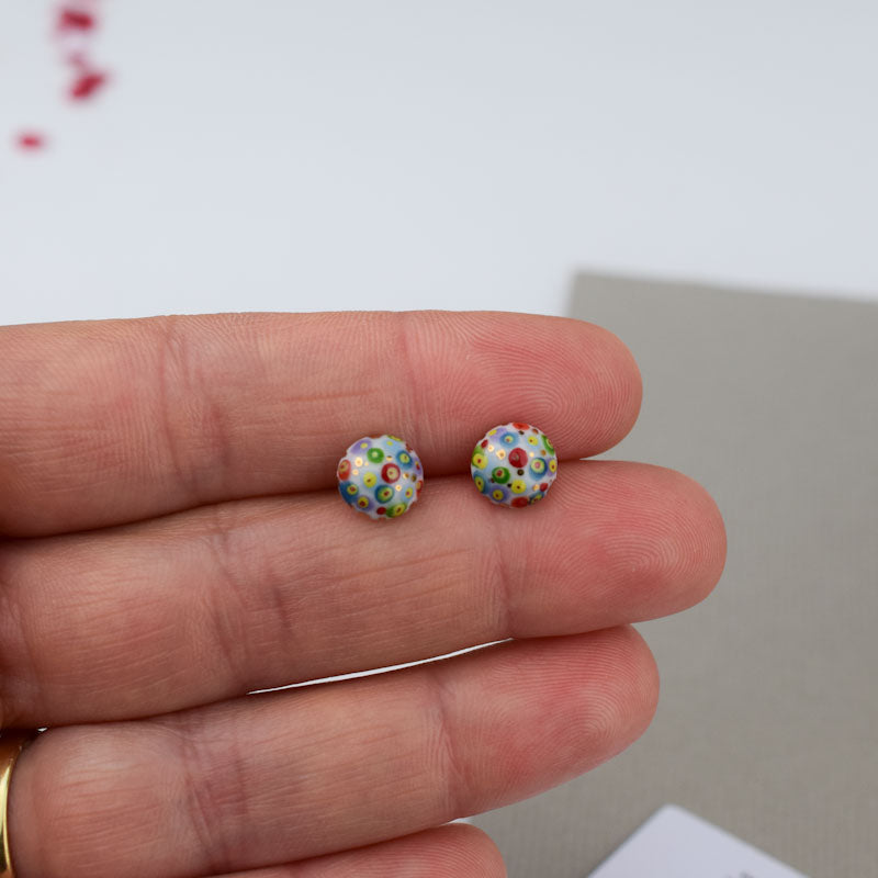 Porcelain stud earrings created and hand-painted by Vali Bondoc with high temperature ceramic dyes and colloidal gold