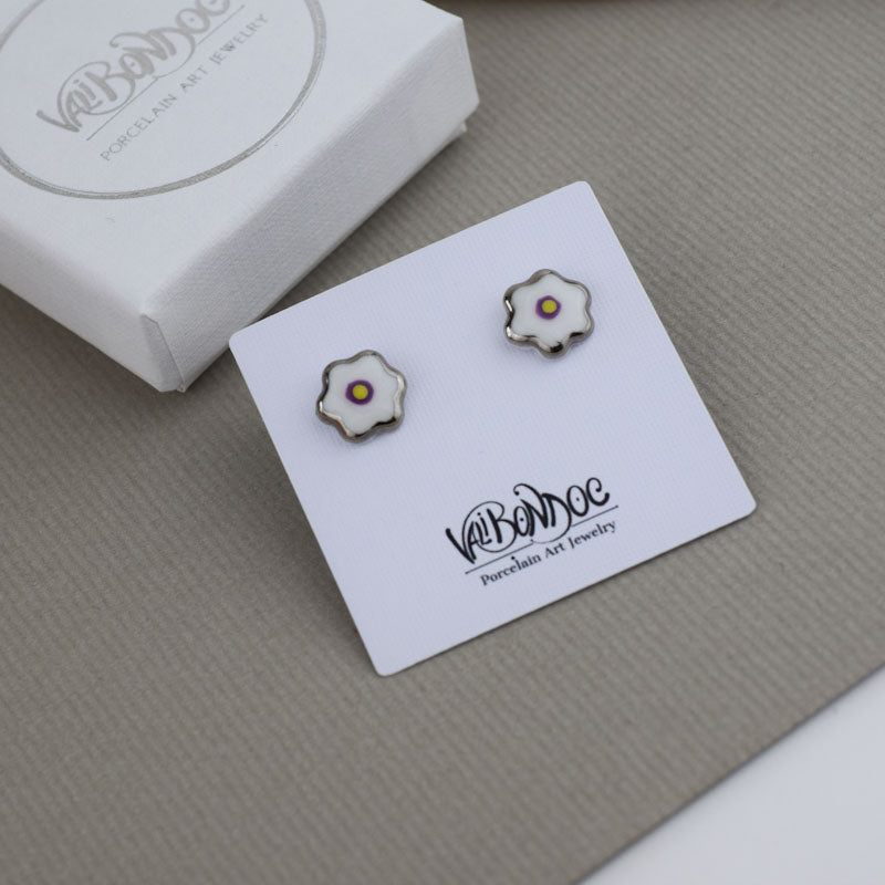 Porcelain stud earrings created and hand-painted by Vali Bondoc with high temperature ceramic dyes and colloidal gold