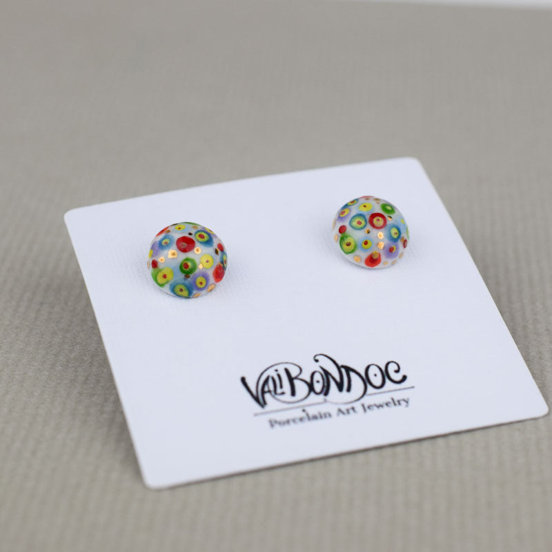 Porcelain stud earrings created and hand-painted by Vali Bondoc with high temperature ceramic dyes and colloidal gold