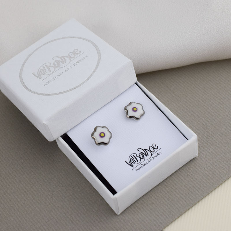Porcelain stud earrings created and hand-painted by Vali Bondoc with high temperature ceramic dyes and colloidal gold