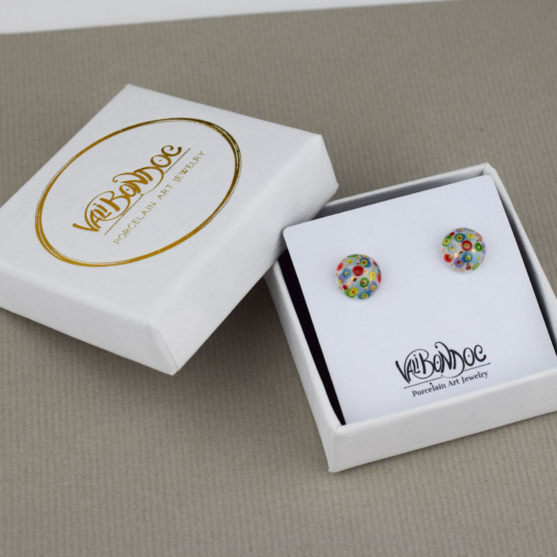Porcelain stud earrings created and hand-painted by Vali Bondoc with high temperature ceramic dyes and colloidal gold