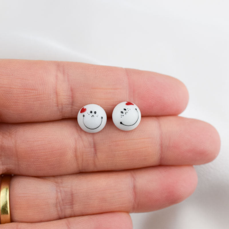 Porcelain stud earrings created and hand-painted by Vali Bondoc with high temperature ceramic dyes