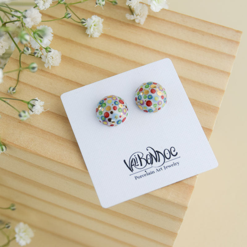 Porcelain stud earrings created and hand-painted by Vali Bondoc with high temperature ceramic dyes and colloidal gold