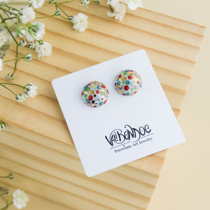 Porcelain stud earrings created and hand-painted by Vali Bondoc with high temperature ceramic dyes and colloidal gold