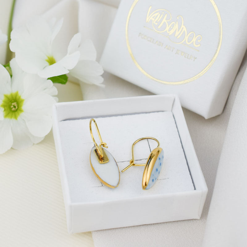 Porcelain stud earrings created and hand-painted by Vali Bondoc with high temperature ceramic dyes and colloidal gold