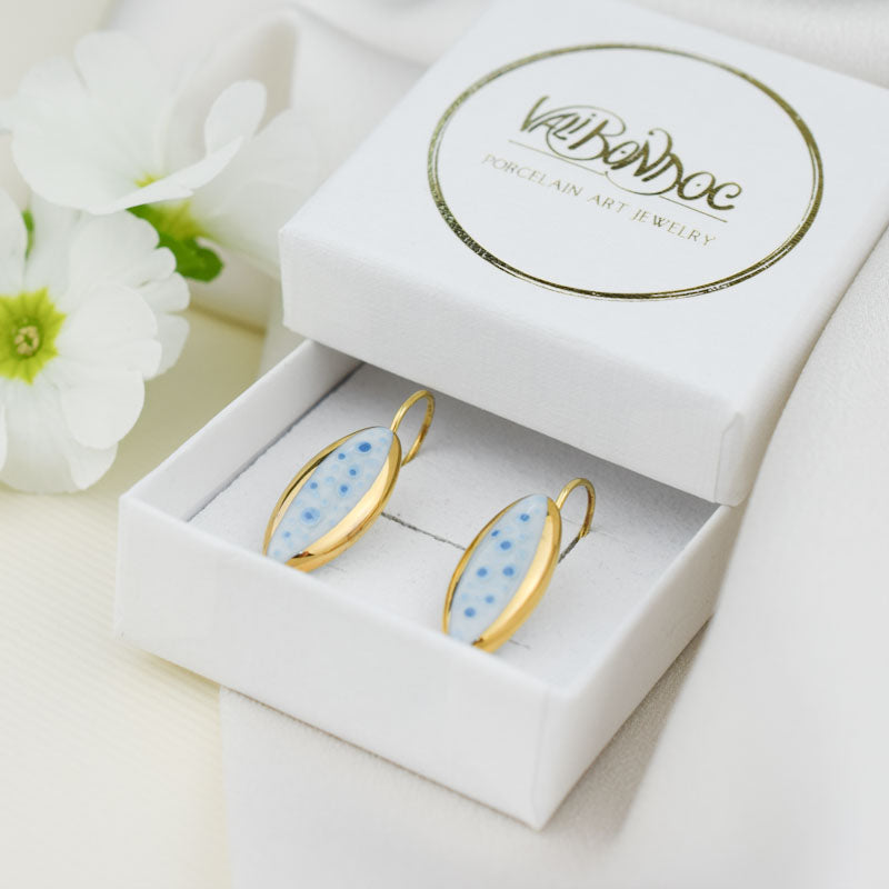 Porcelain stud earrings created and hand-painted by Vali Bondoc with high temperature ceramic dyes and colloidal gold