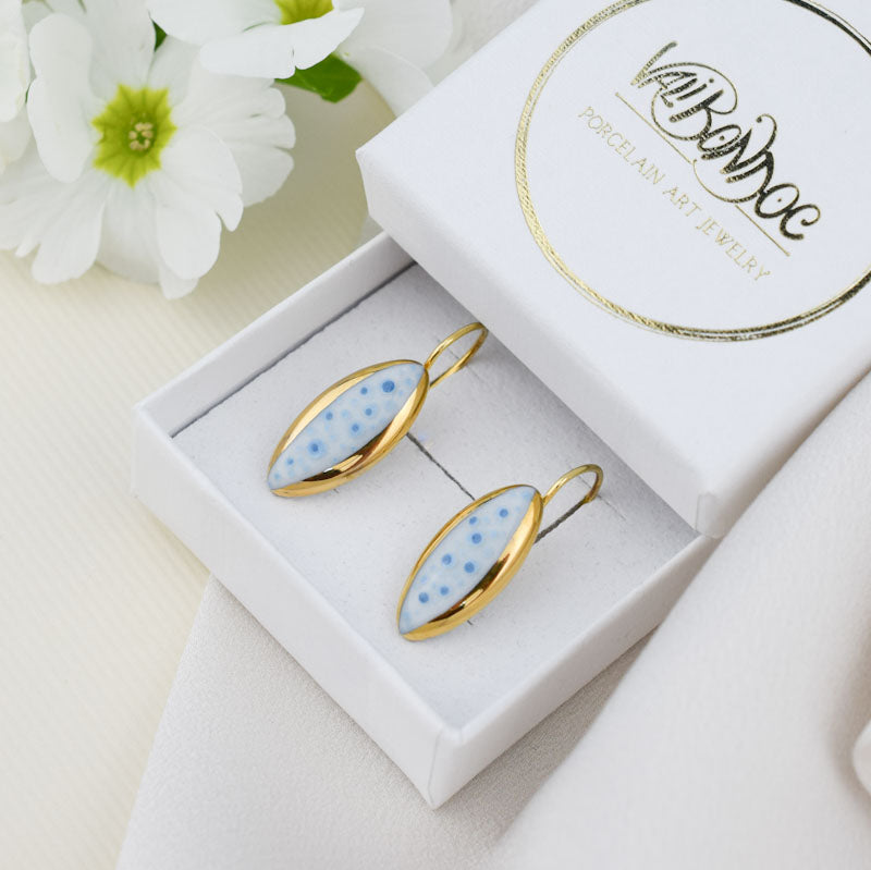 Porcelain stud earrings created and hand-painted by Vali Bondoc with high temperature ceramic dyes and colloidal gold