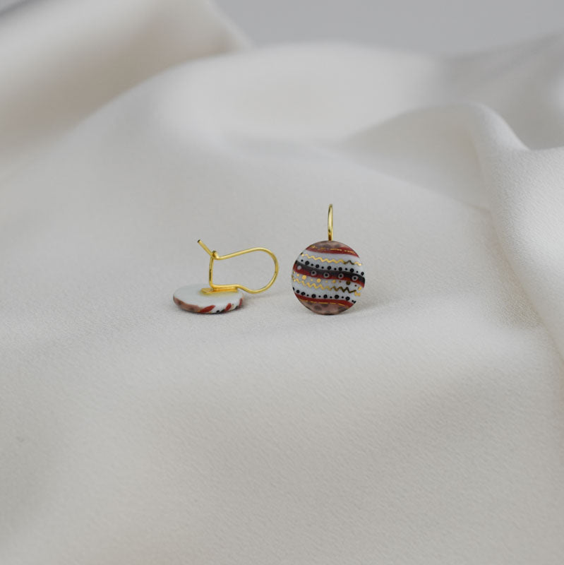 Porcelain hook earrings created and hand-painted by Vali Bondoc with high temperature ceramic dyes and colloidal gold
