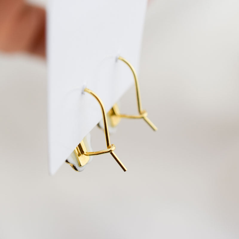 Porcelain hook earrings created and hand-painted by Vali Bondoc with high temperature ceramic dyes and colloidal gold