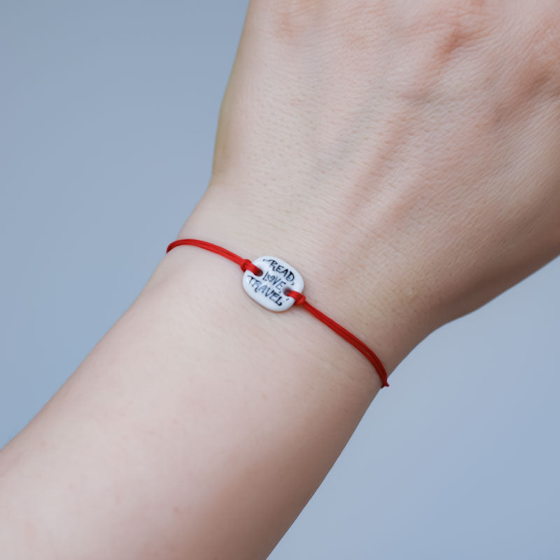 Read, Love, Travel Porcelain bracelet handmade and hand painted by Vali Bondoc. Bratara din portelan modelata si pictata manual de Vali Bondoc