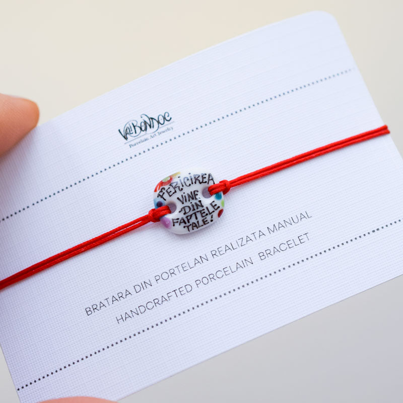 Fericirea vine din faptele tale Porcelain bracelet handmade and hand painted by Vali Bondoc. Bratara din portelan modelata si pictata manual de Vali Bondoc