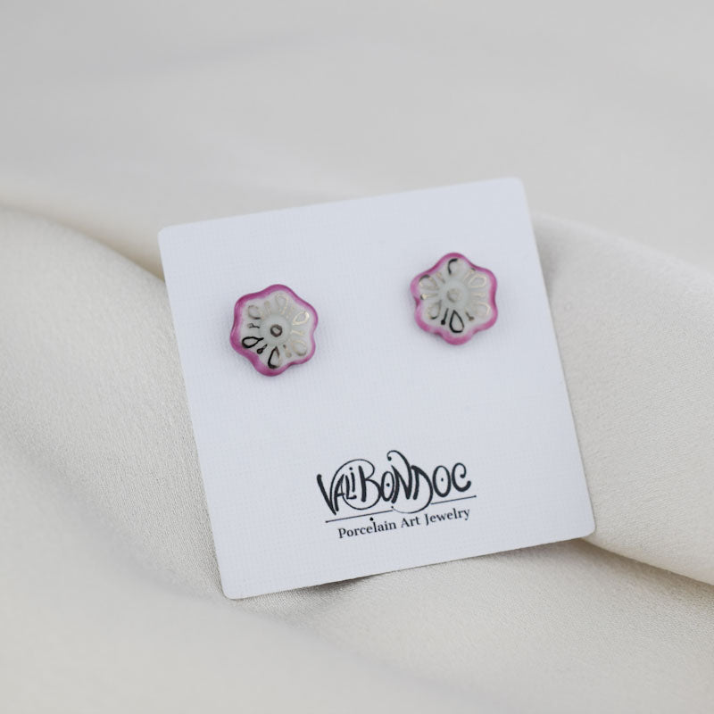 Porcelain stud earrings created and hand-painted by Vali Bondoc with high temperature ceramic dyes and colloidal gold