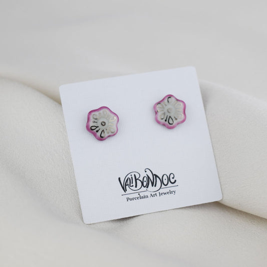 Porcelain stud earrings created and hand-painted by Vali Bondoc with high temperature ceramic dyes and colloidal gold