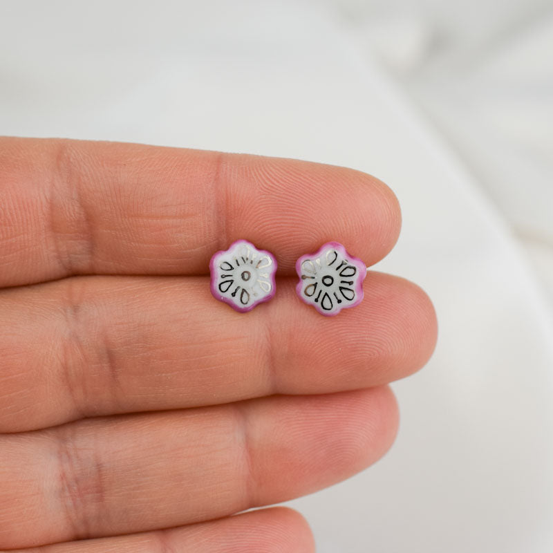 Porcelain stud earrings created and hand-painted by Vali Bondoc with high temperature ceramic dyes and colloidal gold