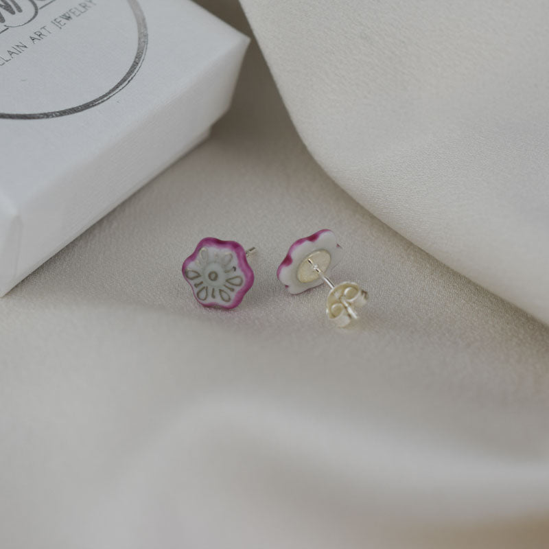 Porcelain stud earrings created and hand-painted by Vali Bondoc with high temperature ceramic dyes and colloidal gold