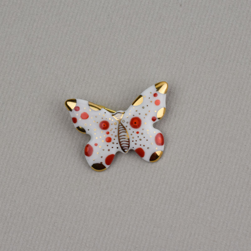 Butterfly. Porcelain brooch created and hand-painted by Vali Bondoc with high temperature ceramic dyes and colloidal gold