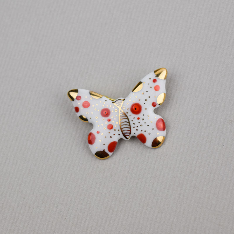 Butterfly. Porcelain brooch created and hand-painted by Vali Bondoc with high temperature ceramic dyes and colloidal gold