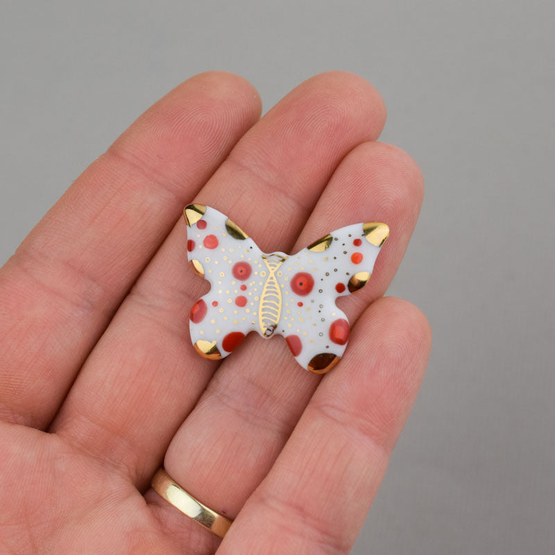 Butterfly. Porcelain brooch created and hand-painted by Vali Bondoc with high temperature ceramic dyes and colloidal gold
