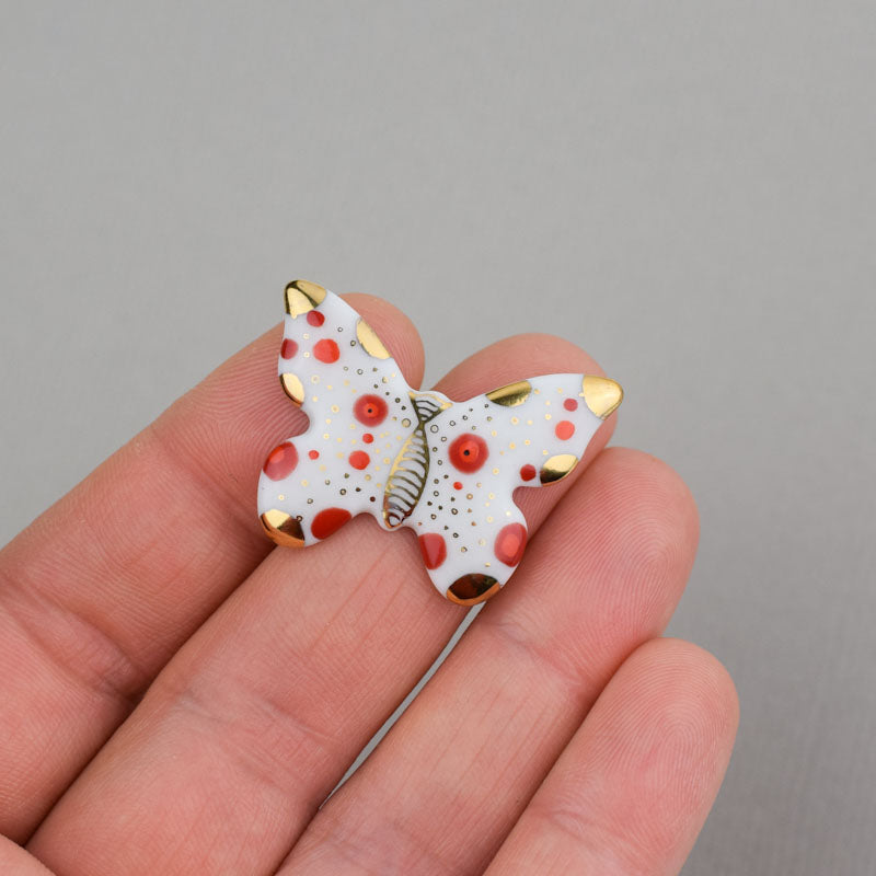Butterfly. Porcelain brooch created and hand-painted by Vali Bondoc with high temperature ceramic dyes and colloidal gold