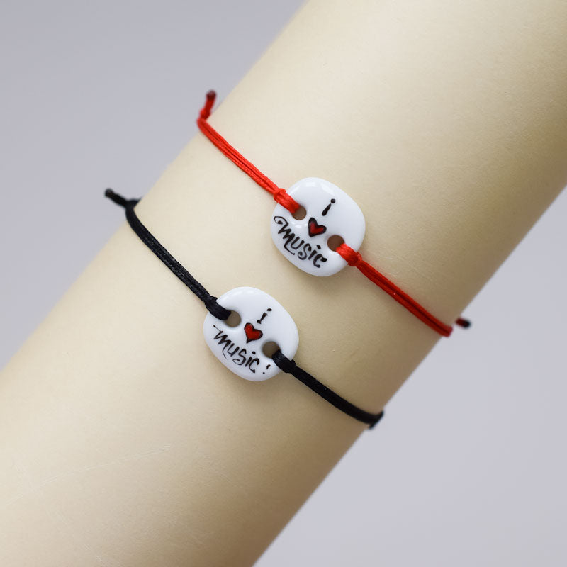 I love music. Porcelain bracelet handmade and hand painted by Vali Bondoc