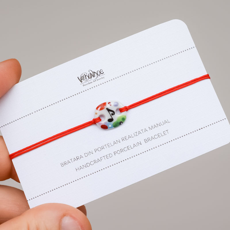 Musical note .Porcelain bracelet handmade and hand painted by Vali Bondoc