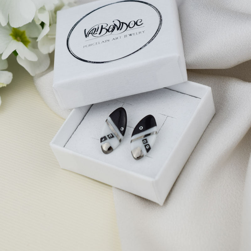 Porcelain stud earrings created and hand-painted by Vali Bondoc with high temperature ceramic dyes and colloidal platinum