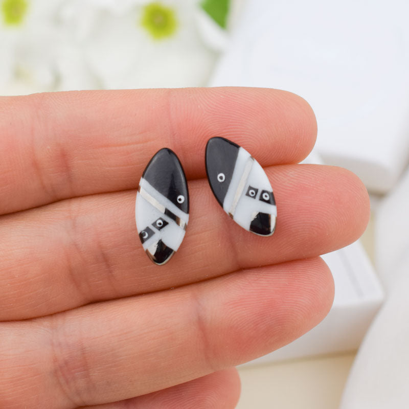 Porcelain stud earrings created and hand-painted by Vali Bondoc with high temperature ceramic dyes and colloidal platinum