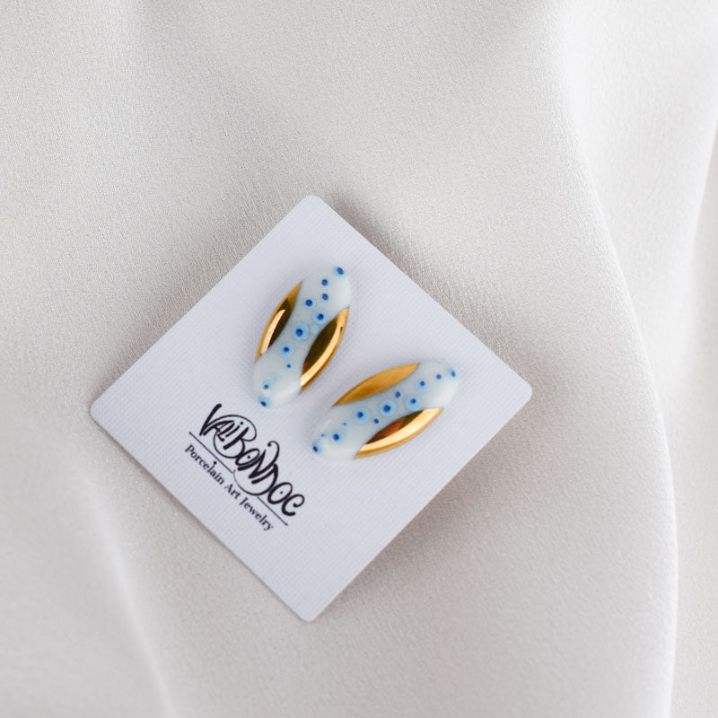 Porcelain stud earrings created and hand-painted by Vali Bondoc with high temperature ceramic dyes and colloidal gold