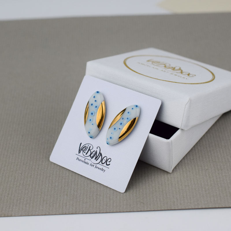 Porcelain stud earrings created and hand-painted by Vali Bondoc with high temperature ceramic dyes and colloidal gold