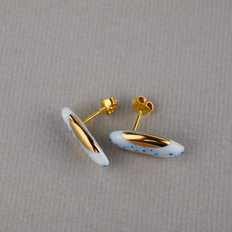 Porcelain stud earrings created and hand-painted by Vali Bondoc with high temperature ceramic dyes and colloidal gold