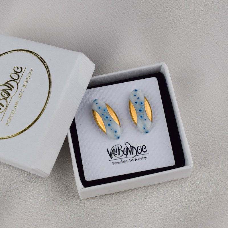 Porcelain stud earrings created and hand-painted by Vali Bondoc with high temperature ceramic dyes and colloidal gold