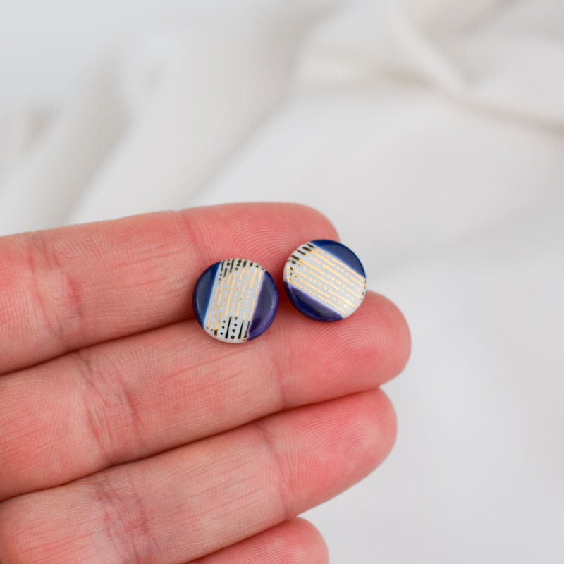 Porcelain stud earrings created and hand-painted by Vali Bondoc with high temperature ceramic dyes and gold