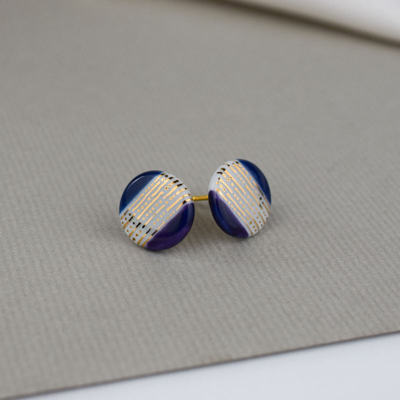 Porcelain stud earrings created and hand-painted by Vali Bondoc with high temperature ceramic dyes and gold