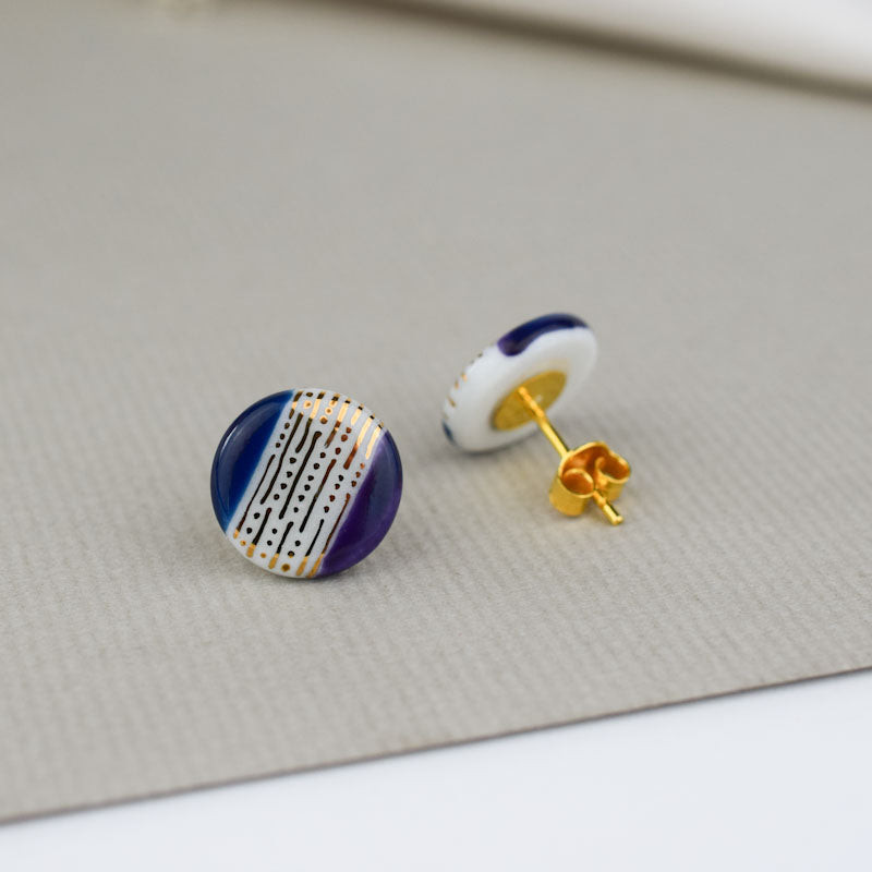 Porcelain stud earrings created and hand-painted by Vali Bondoc with high temperature ceramic dyes and gold